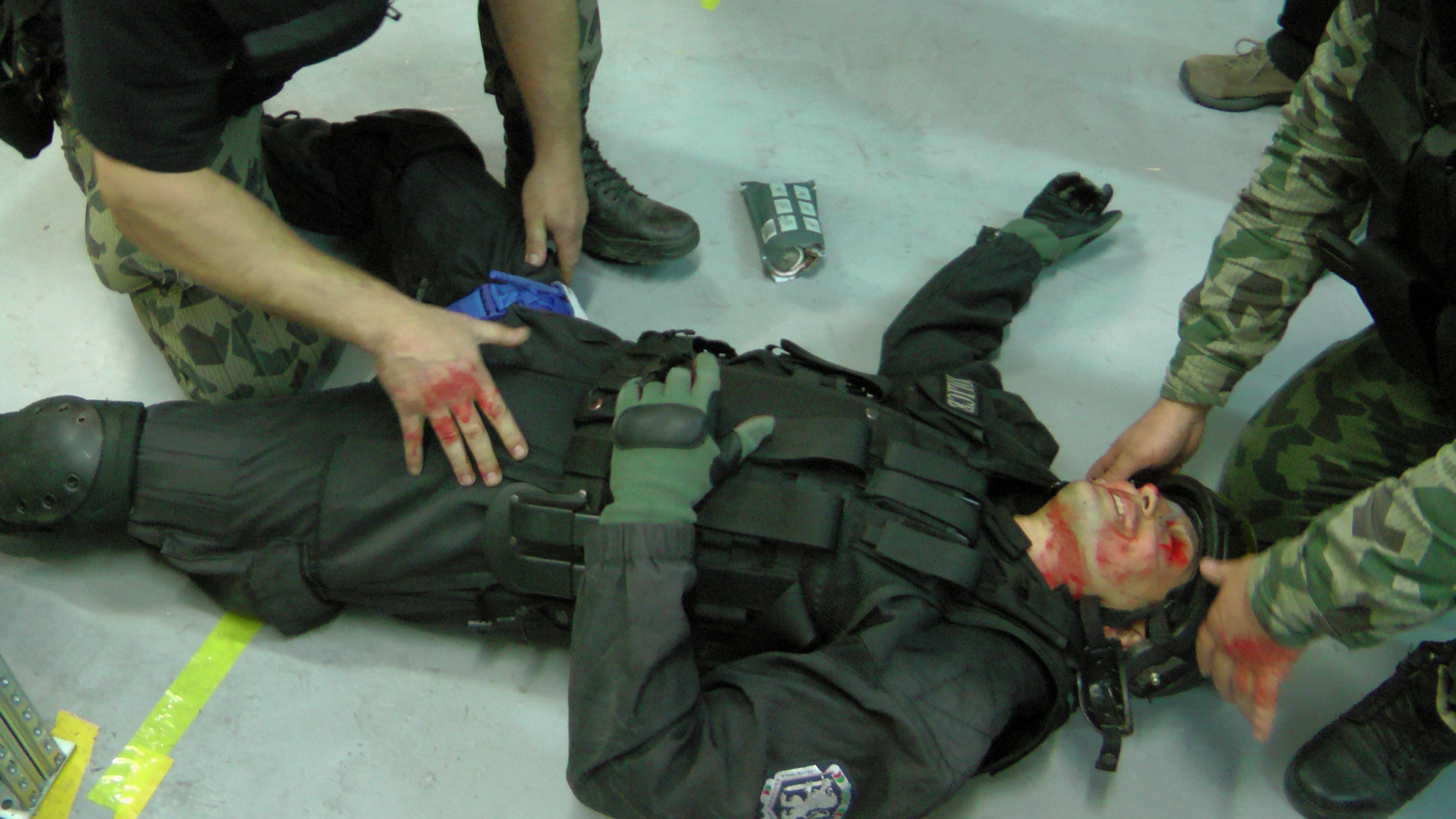 Jim's students of Bulgaria's national counterterrorist team applies a tourniquet to this downed Special Operations officer during a realistic scenario.